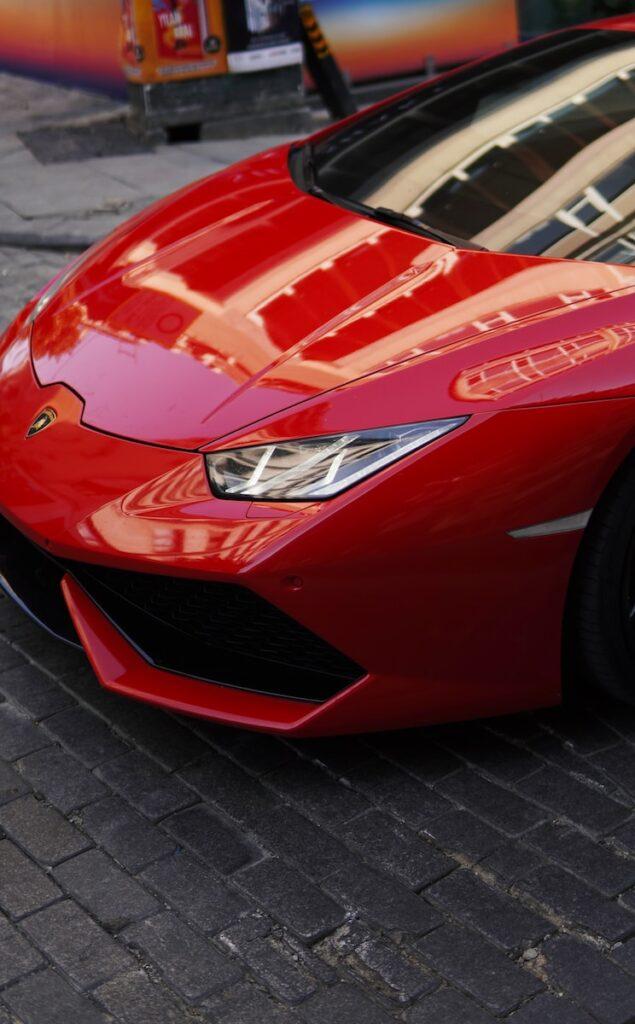 red ferrari car on road