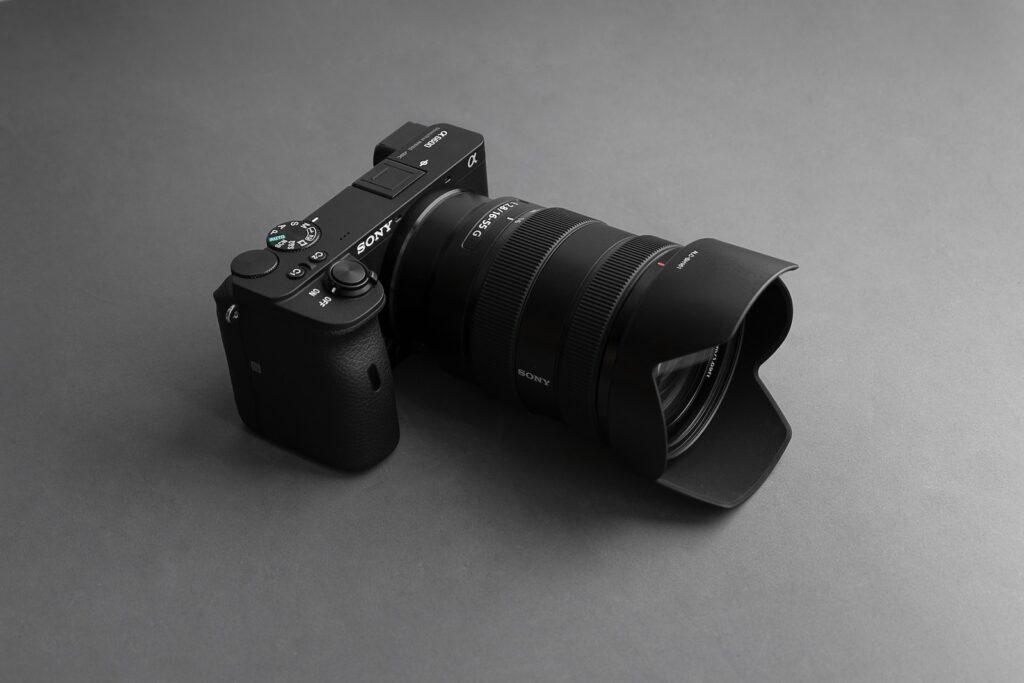 a black camera sitting on top of a table